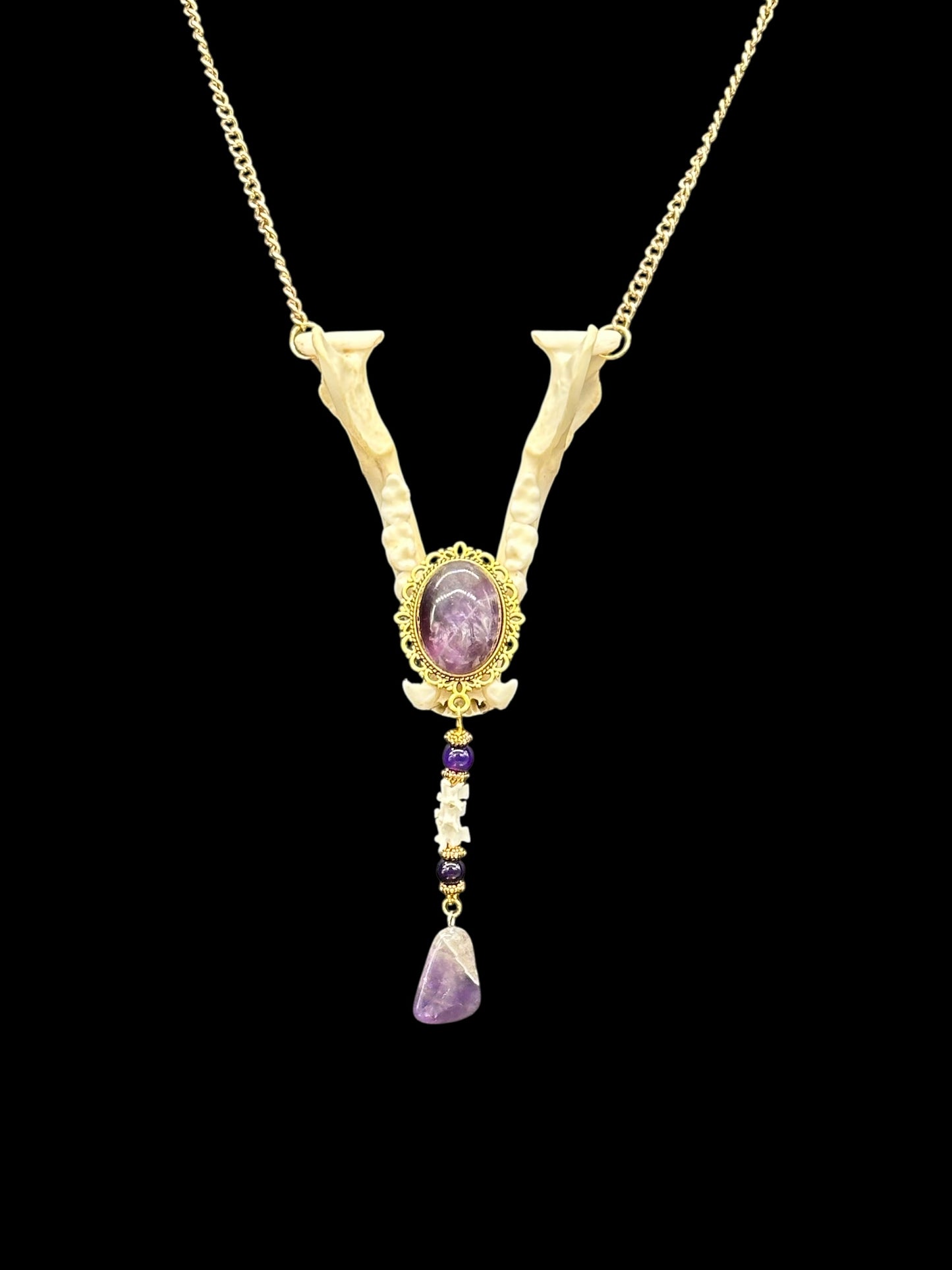 Raccoon Jaw with Amethyst Cabochon