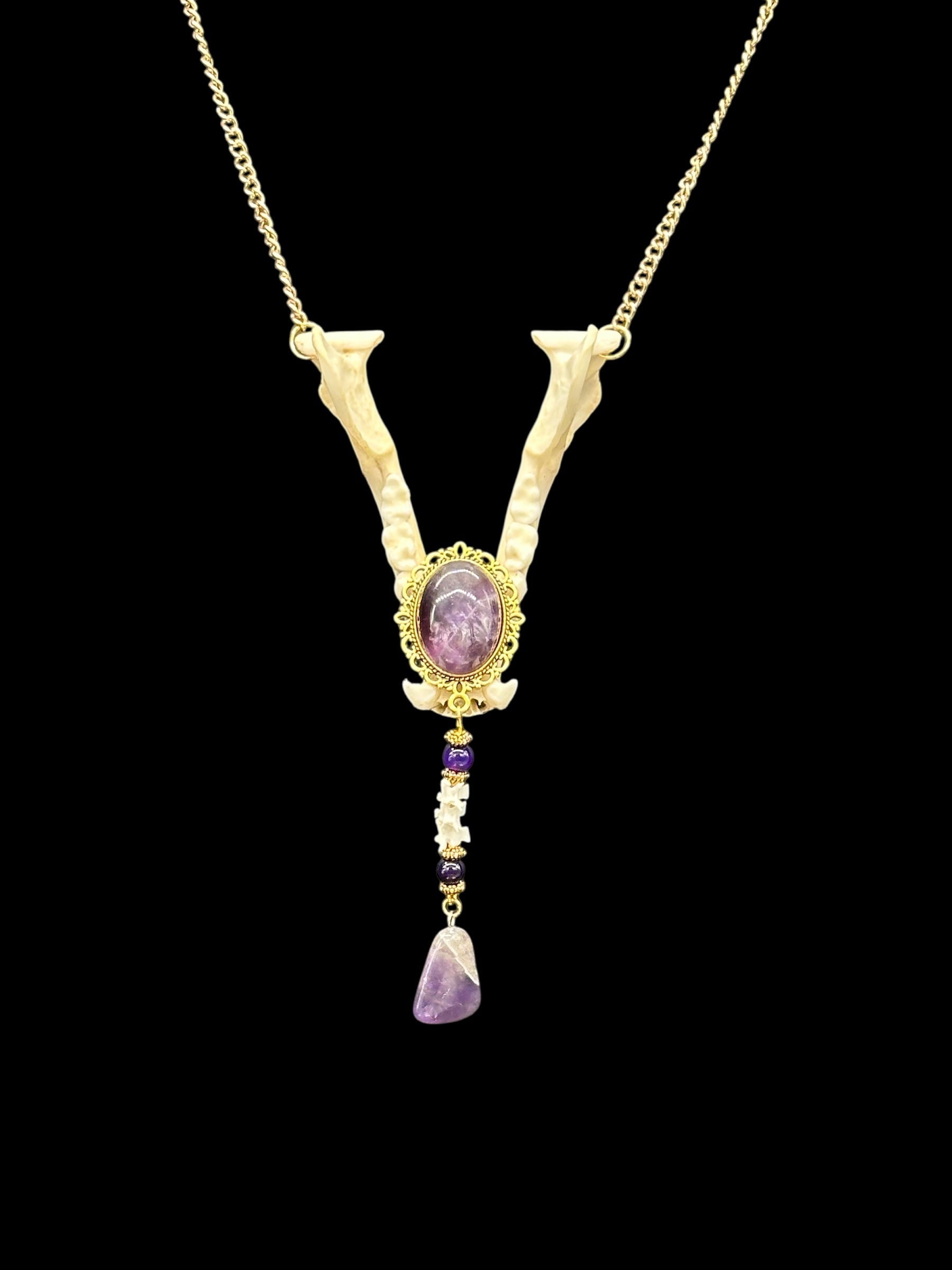 Raccoon Jaw with Amethyst Cabochon